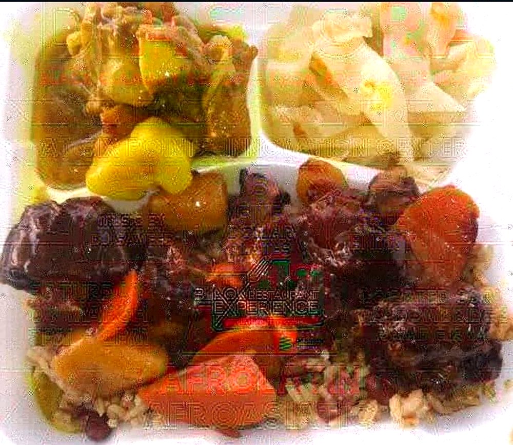 Brown stew plate over rice and peas